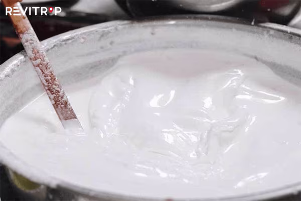 Mixing the batter for rice rolls is also an art.