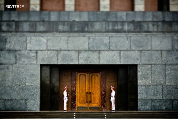 Soldiers stand guard the entrance of Ho Chi Minh's Mausoleum.