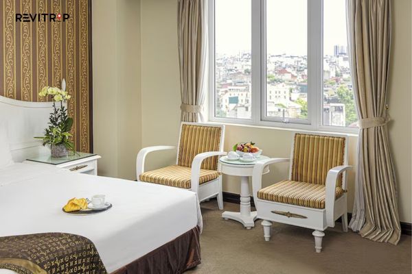 Spacious guest room at Chalcedony Hotel Hanoi with city view