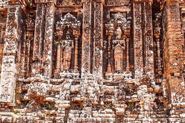 Architectural detail of weathered brickwork and carvings
