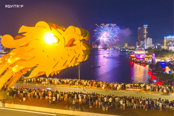Crowds gathering by the Han River before the fireworks in Da Nang