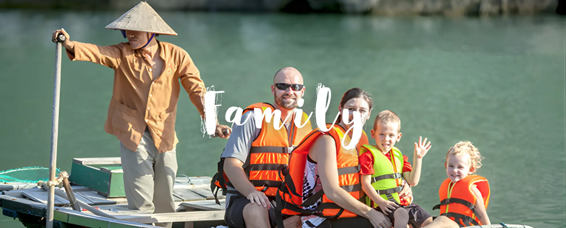 Family cycling through rice fields in Mai Chau valley Vietnam