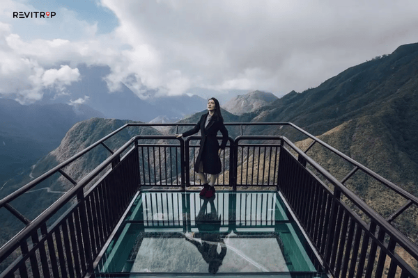 Looking down through the transparent glass floor of the Rong May glass bridge Sapa