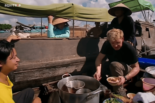 Gordon Ramsay at Cai Rang floating market enjoying hu tieu noodle soup on the Can Tho river in the early morning