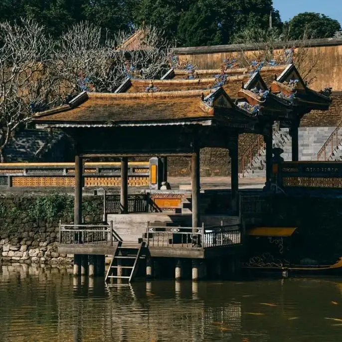 Hue, Vietnam's former imperial capital. Visit the UNESCO Citadel, royal tombs, and ancient pagodas along the banks of the Perfume River.