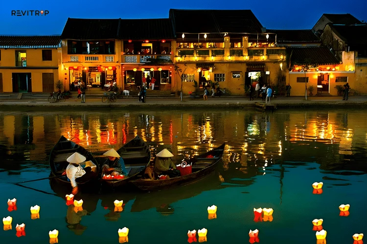 Lantern reflections on the Thu Bon River in Hoi An Vietnam at sunset
