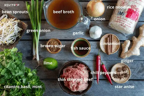 Pho recipe ingredients laid out including star anise, cinnamon, cloves, coriander seeds and ginger for the broth