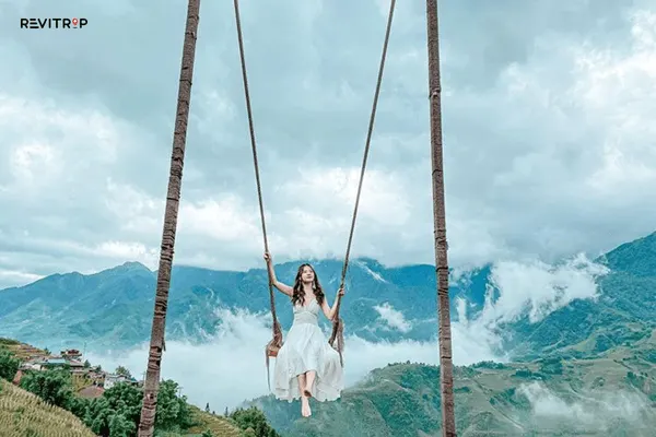 Swing Sapa cloud swings over the valley with mountain and forest backdrop on a misty day